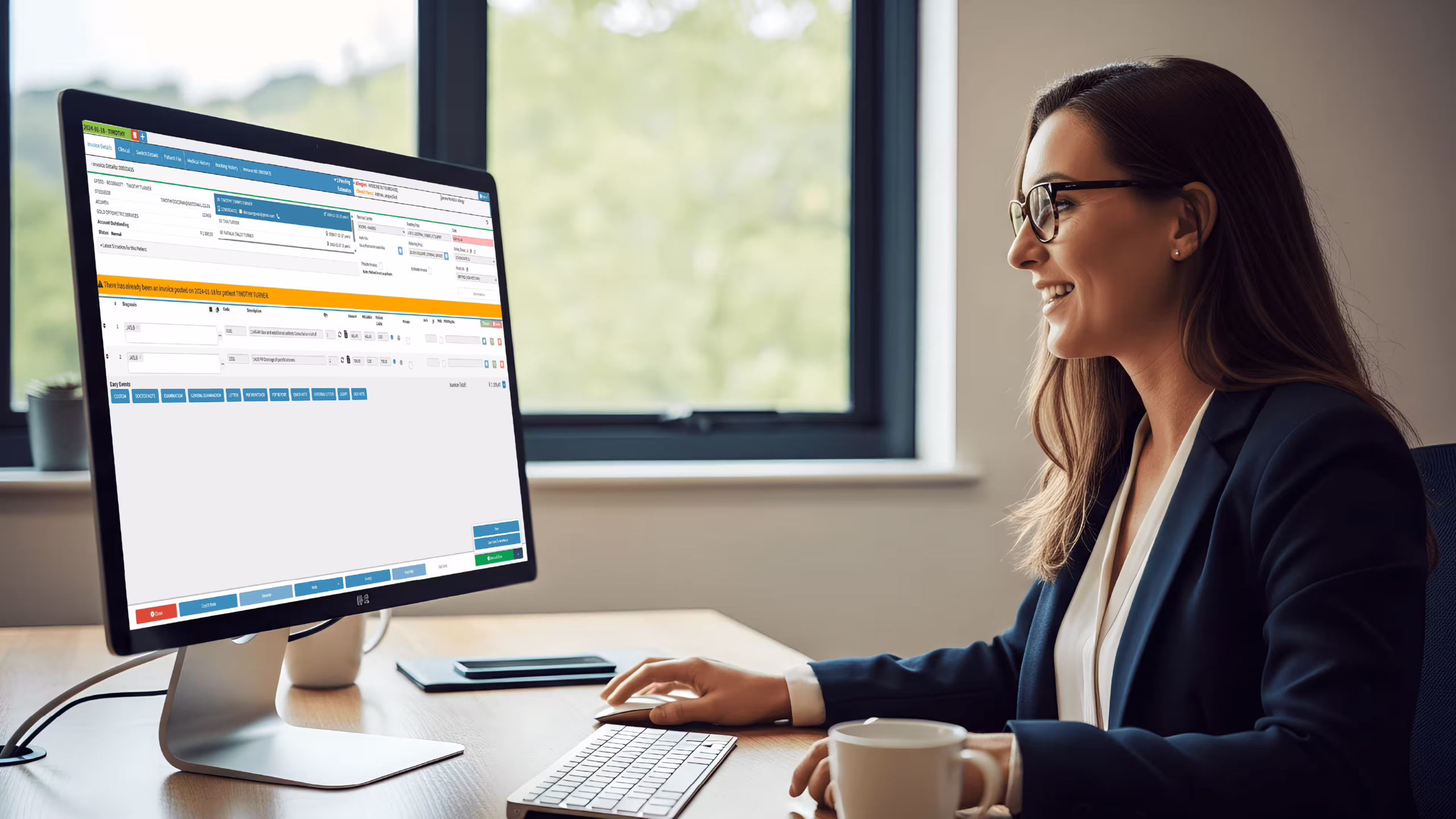 New Zealand practice manager using health care management system software with scheduling, billing, and clinical dashboards visible