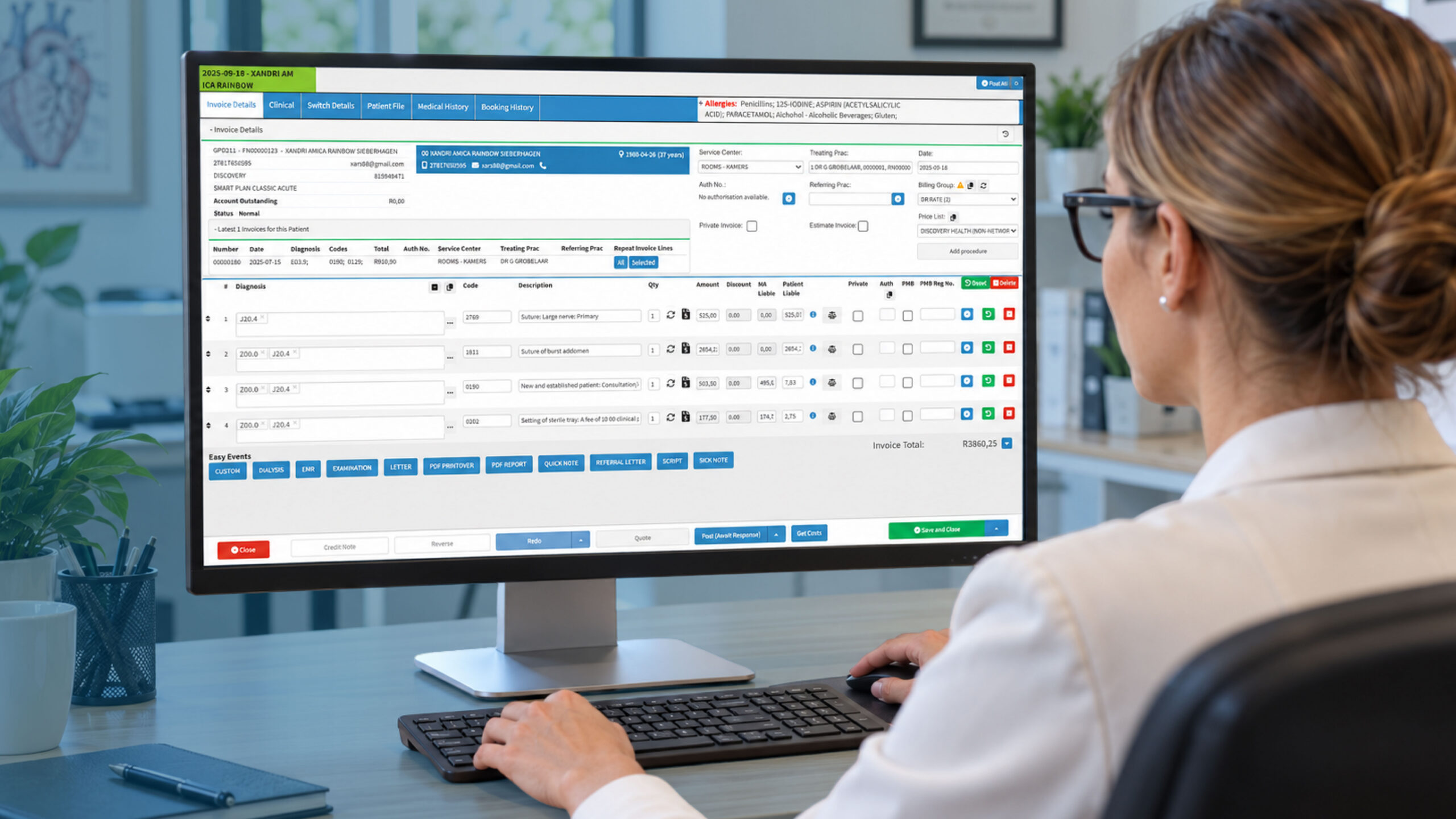 Medical practice administrator using medical claims management software to manage healthcare claims